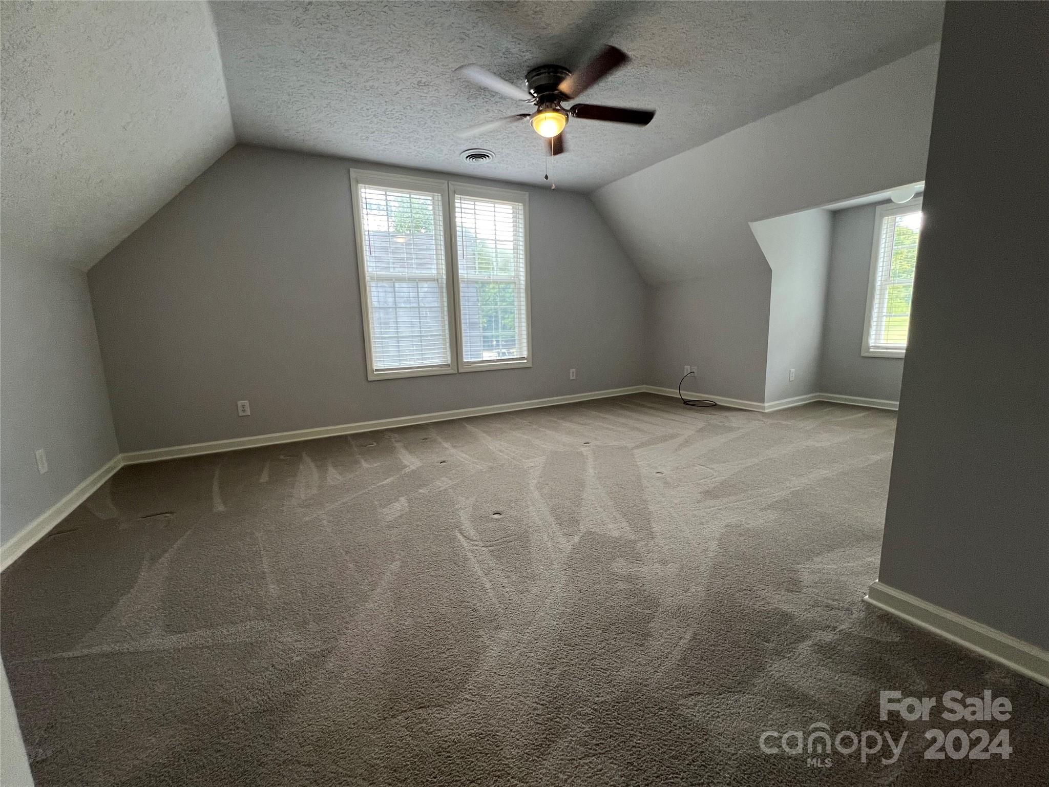 148 Riff Drive Forest City, NC 28043 - Photo 25 of 40 an empty room with windows and fan