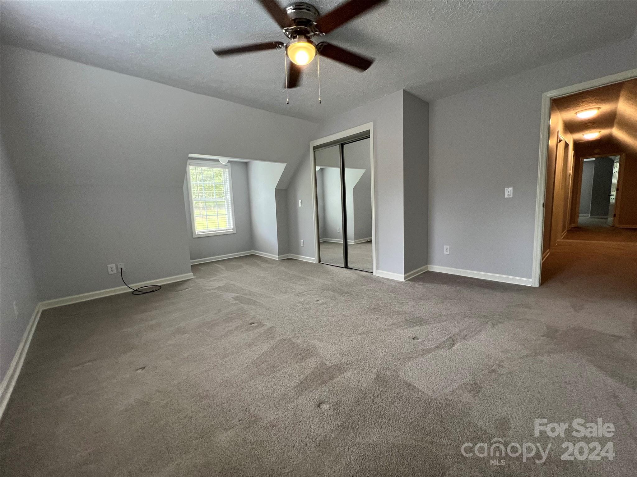 148 Riff Drive Forest City, NC 28043 - Photo 26 of 40 an empty room with chandelier fan and windows