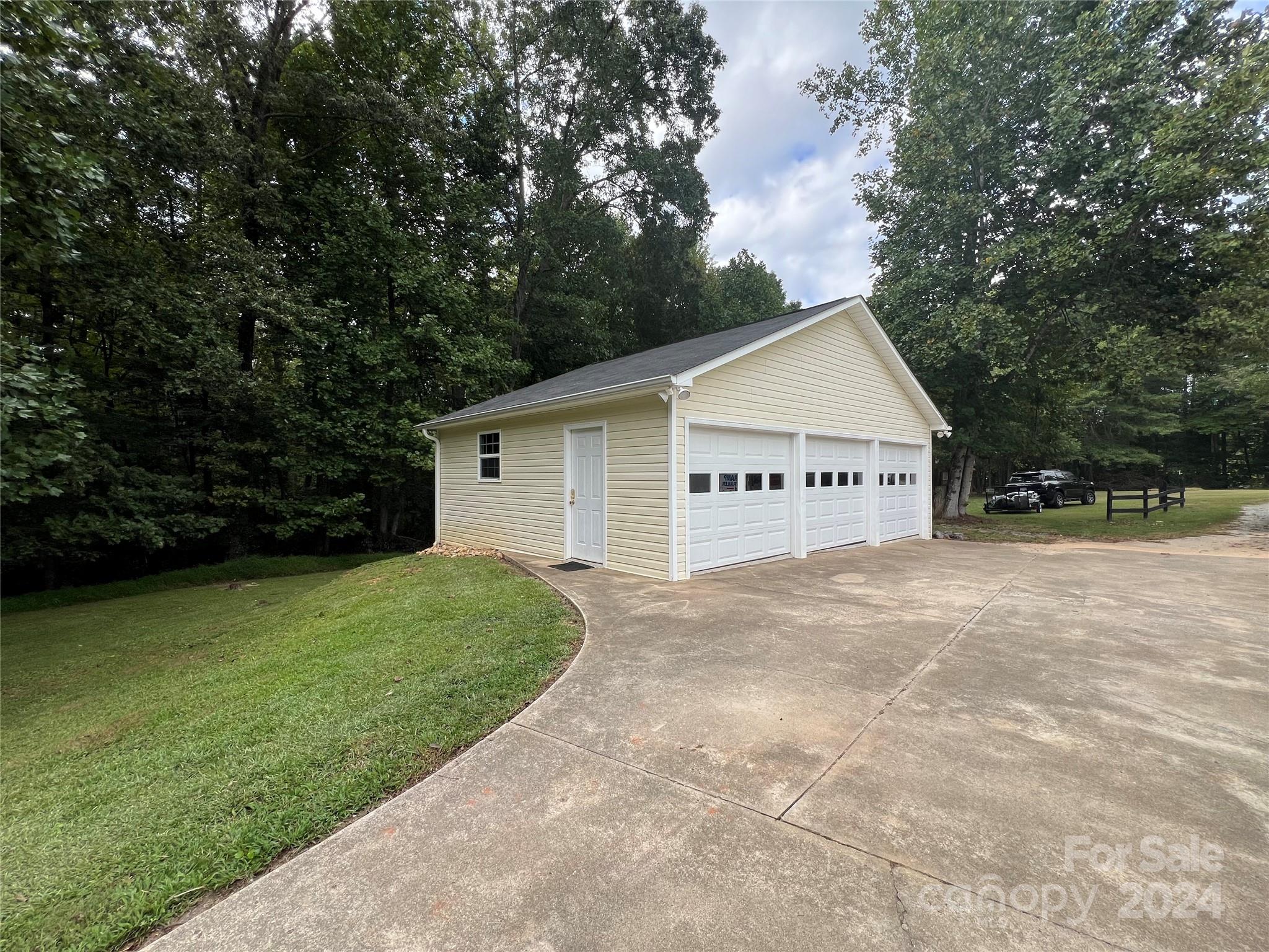148 Riff Drive Forest City, NC 28043 - Photo 29 of 40 a view of a house with a yard and garage
