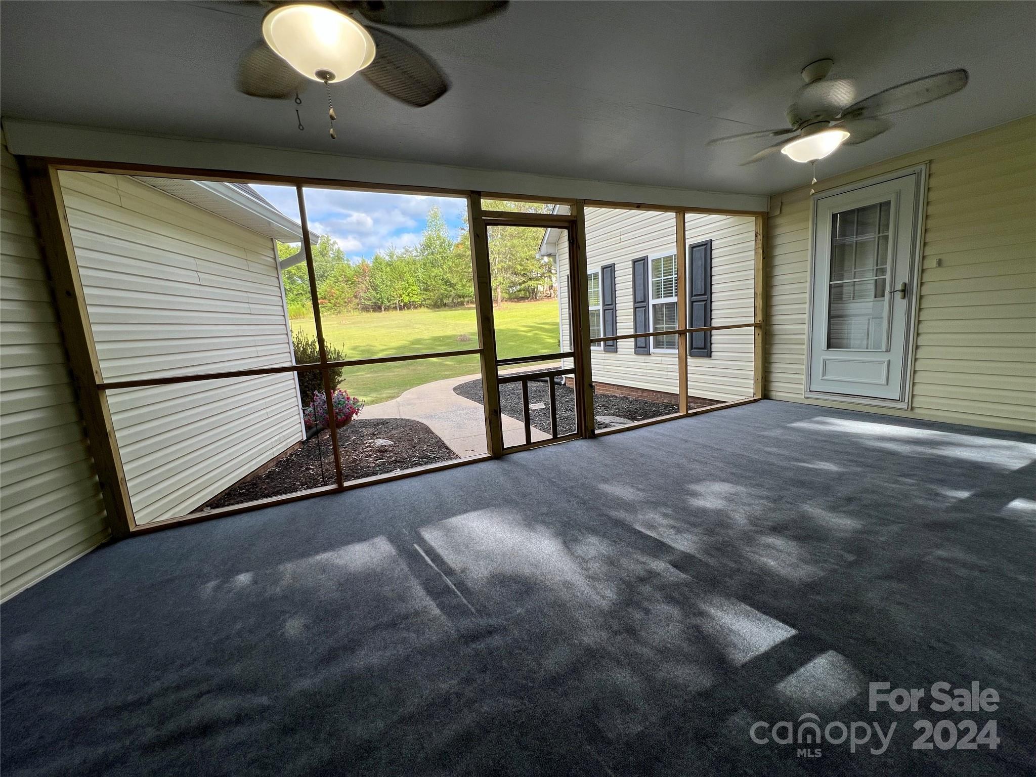 148 Riff Drive Forest City, NC 28043 - Photo 3 of 40 a view of empty room with wooden floor and fan