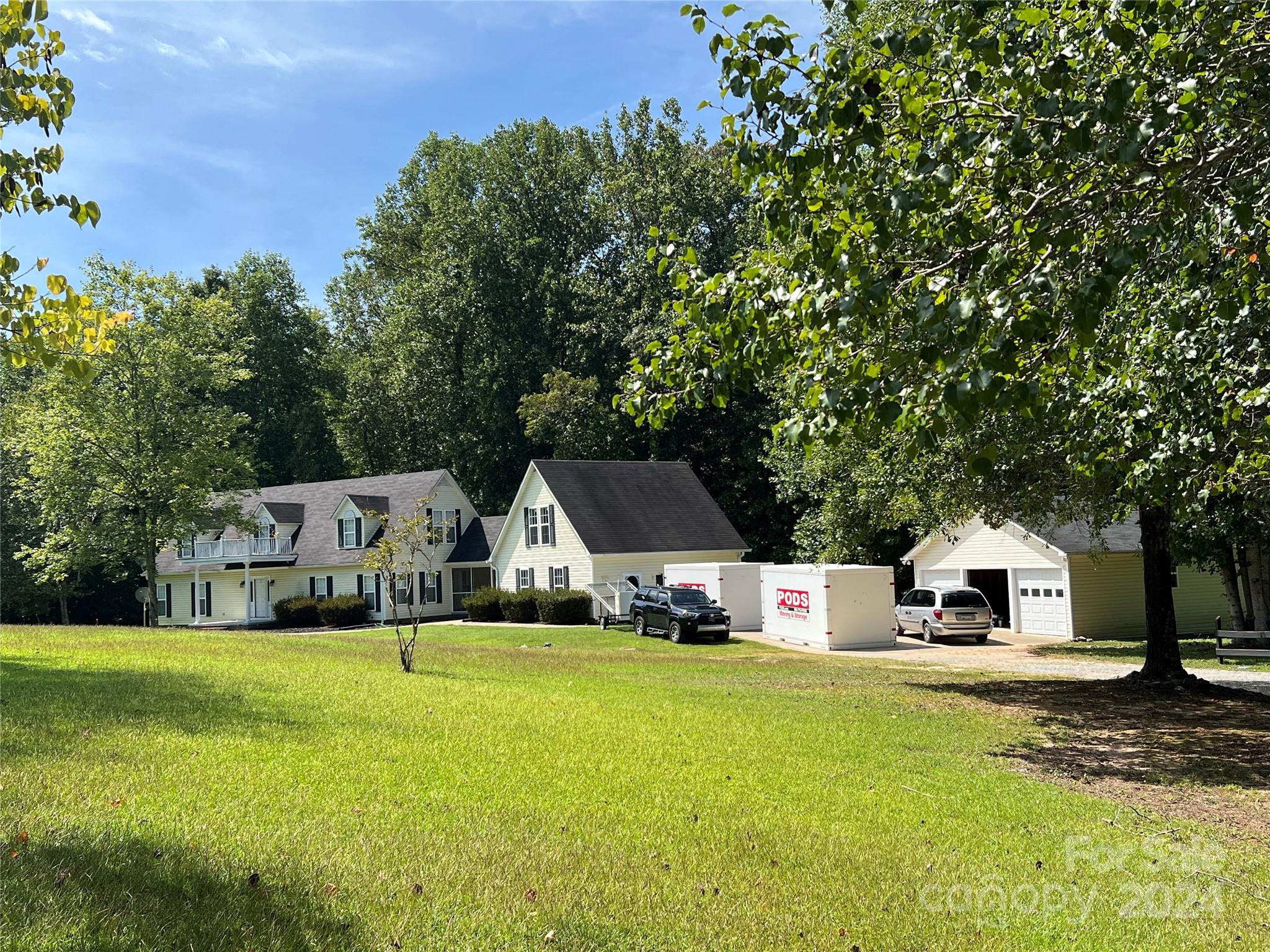 148 Riff Drive Forest City, NC 28043 - Photo 33 of 40 a front view of a house with garden