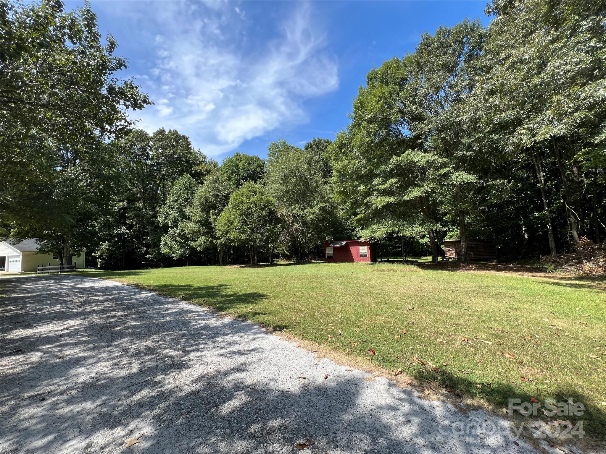 148 Riff Drive Forest City, NC 28043 - Photo 34 of 40 a view of a field with trees in the background