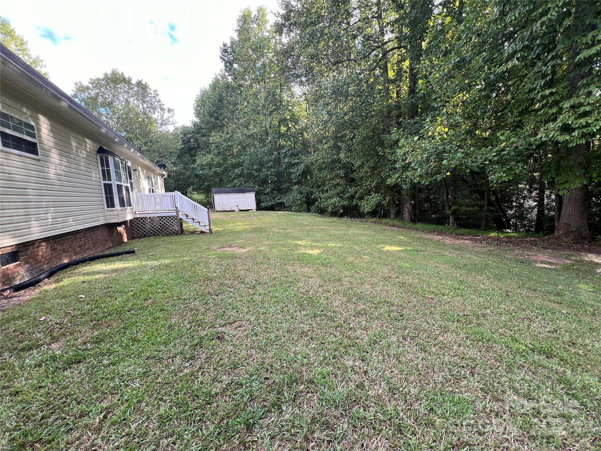 148 Riff Drive Forest City, NC 28043 - Photo 36 of 40 a view of a backyard with a house