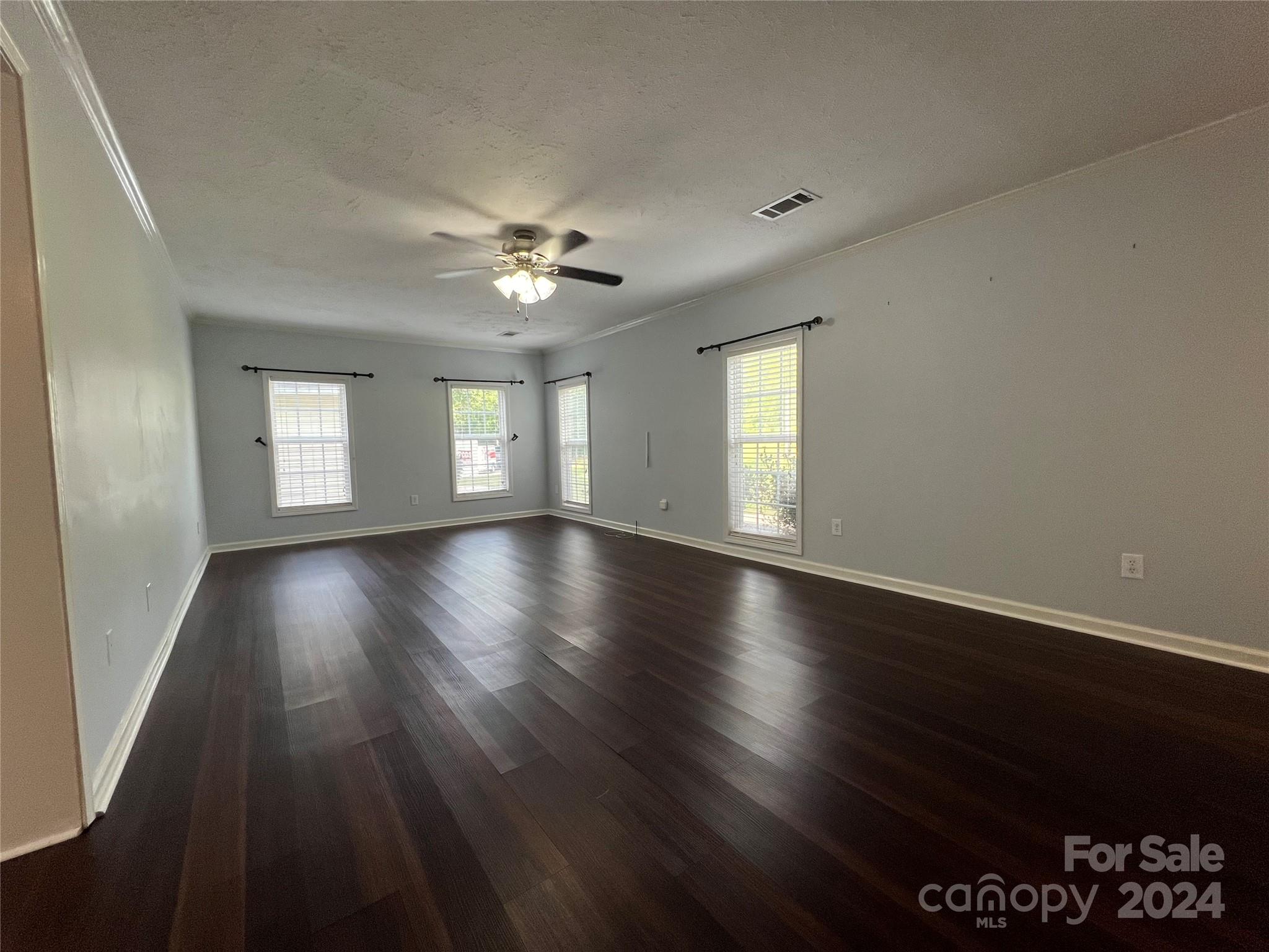 148 Riff Drive Forest City, NC 28043 - Photo 7 of 40 a view of an empty room with wooden floor and a window