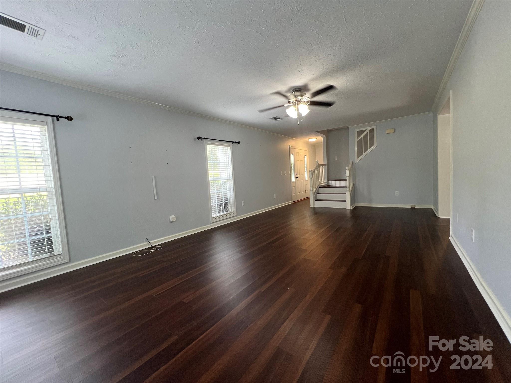 148 Riff Drive Forest City, NC 28043 - Photo 8 of 40 wooden floor in an empty room with a window