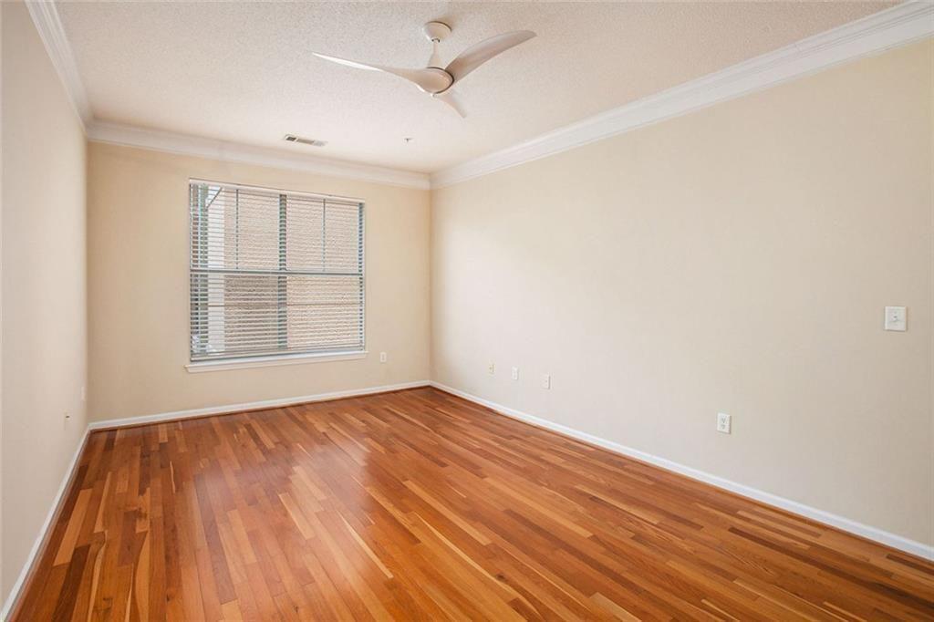 10 Perimeter Summit Boulevard, Unit 3301 Atlanta, GA 30319 - Photo 16 of 36 wooden floor in an empty room with a window