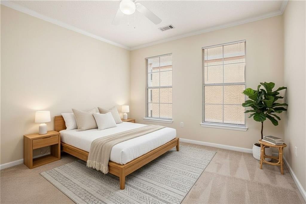 10 Perimeter Summit Boulevard, Unit 3301 Atlanta, GA 30319 - Photo 19 of 36 a bedroom with a large bed and a potted plant