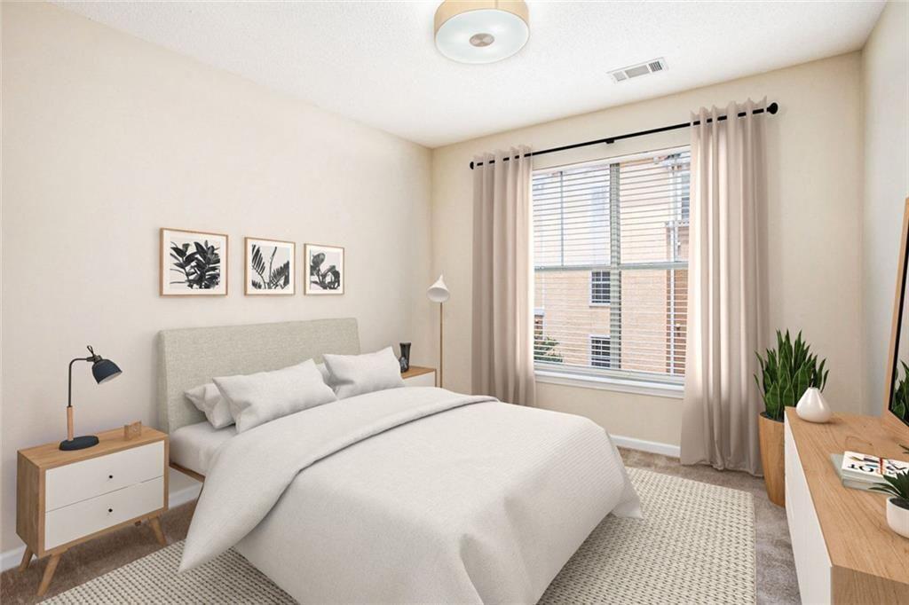 10 Perimeter Summit Boulevard, Unit 3301 Atlanta, GA 30319 - Photo 21 of 36 a bedroom with a large bed and a large window