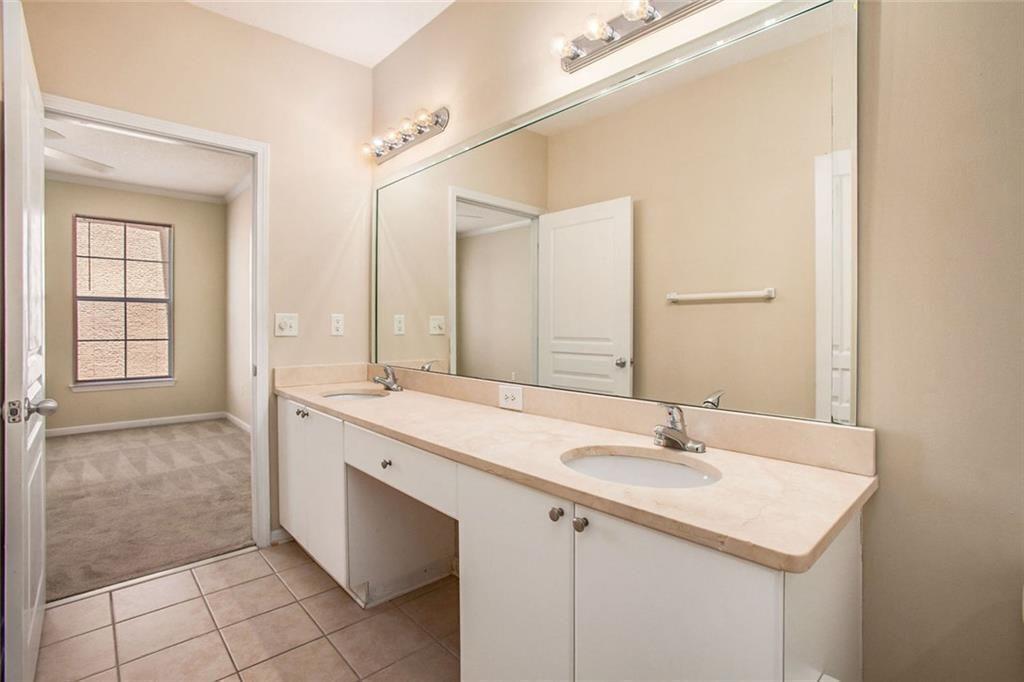 10 Perimeter Summit Boulevard, Unit 3301 Atlanta, GA 30319 - Photo 25 of 36 a bathroom with a sink and a mirror