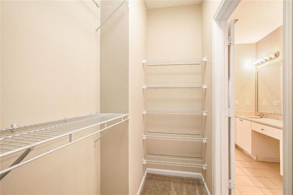 10 Perimeter Summit Boulevard, Unit 3301 Atlanta, GA 30319 - Photo 27 of 36 a view of walk in closet with empty racks