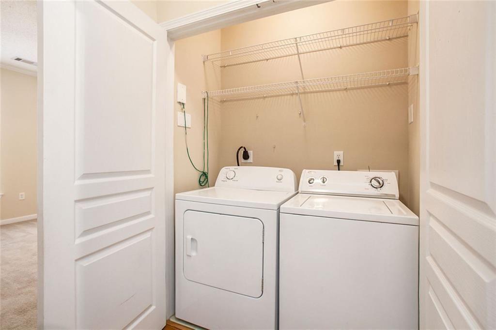 10 Perimeter Summit Boulevard, Unit 3301 Atlanta, GA 30319 - Photo 28 of 36 a utility room with dryer and washer