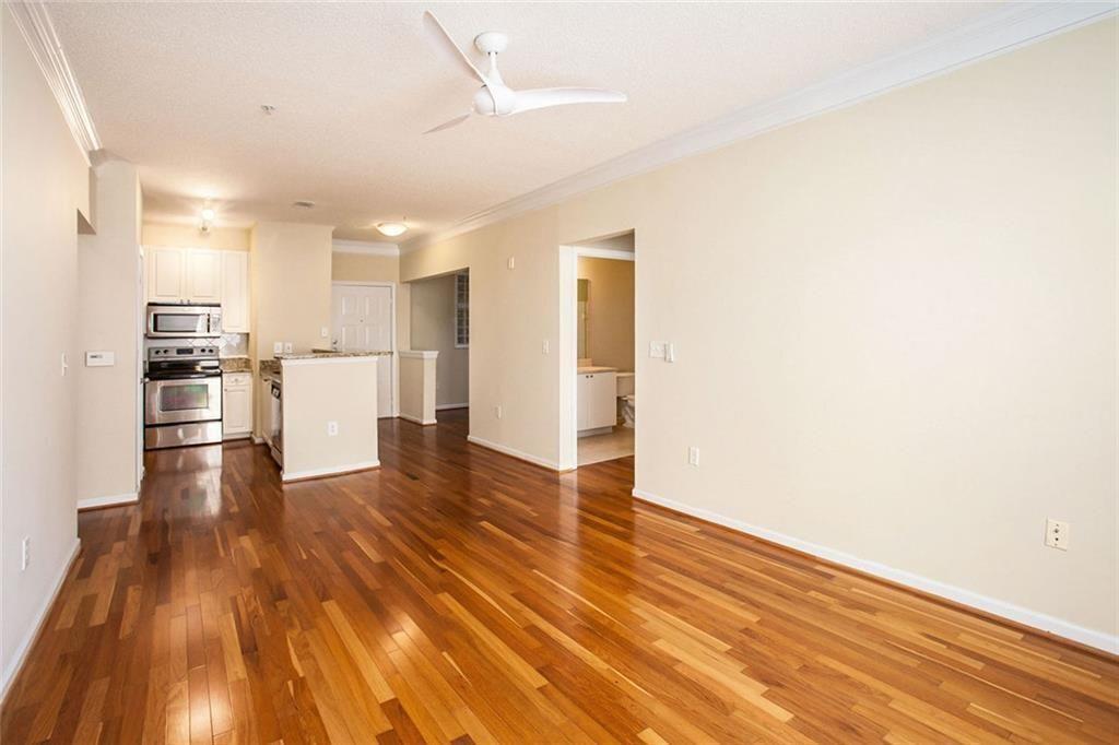 10 Perimeter Summit Boulevard, Unit 3301 Atlanta, GA 30319 - Photo 4 of 36 a view of kitchen view wooden floors and stainless steel appliances