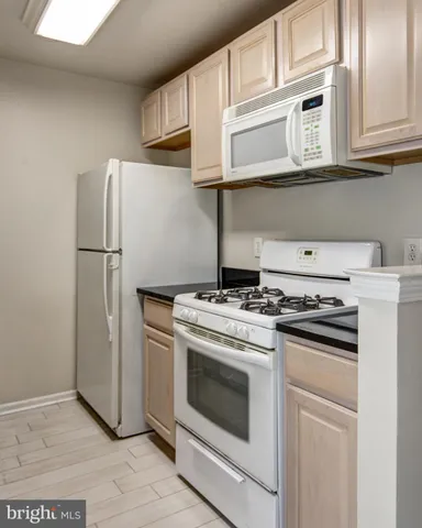 a kitchen that has a sink and a stove