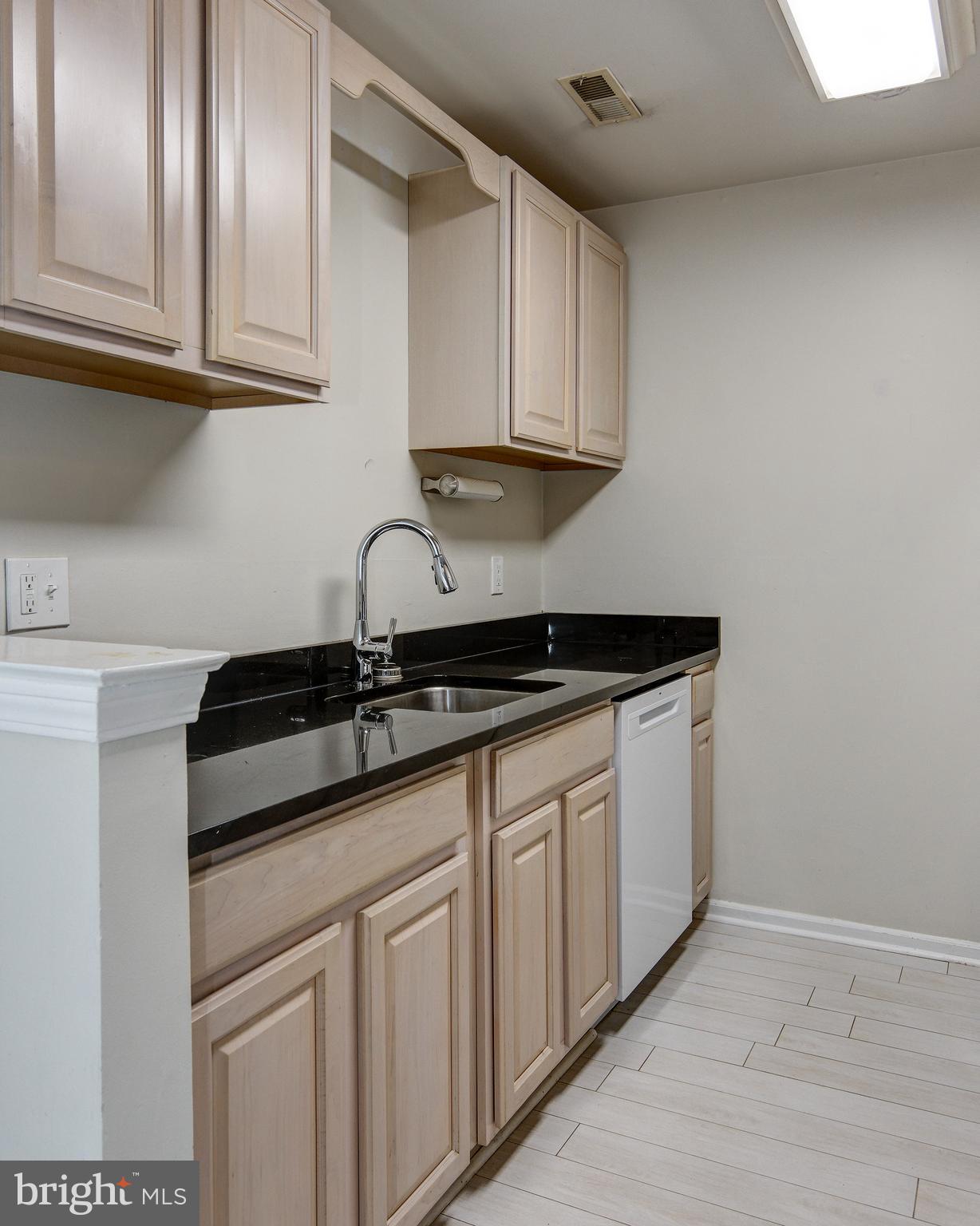 328 Tavistock Cherry Hill, NJ 08034 - Photo 14 of 23 a kitchen with granite countertop white cabinets and a sink