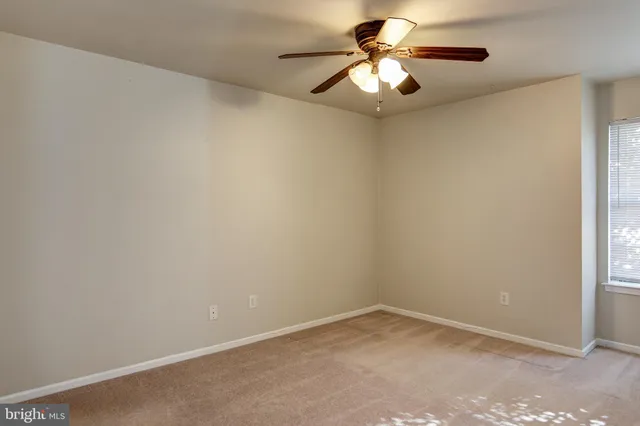an empty room with closet area