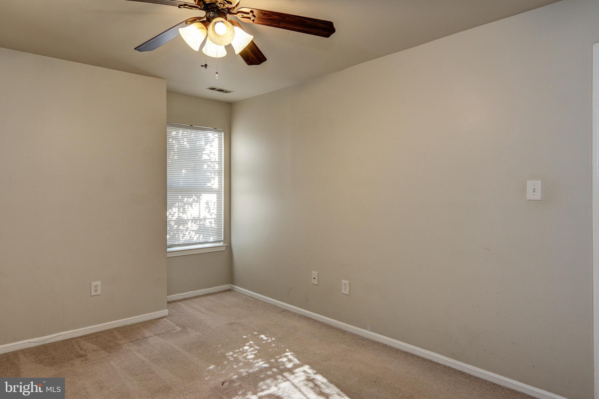 328 Tavistock Cherry Hill, NJ 08034 - Photo 17 of 23 an empty room with windows and fan