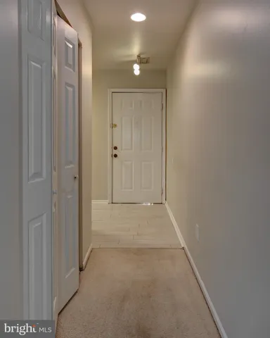 a view of empty room with a fireplace