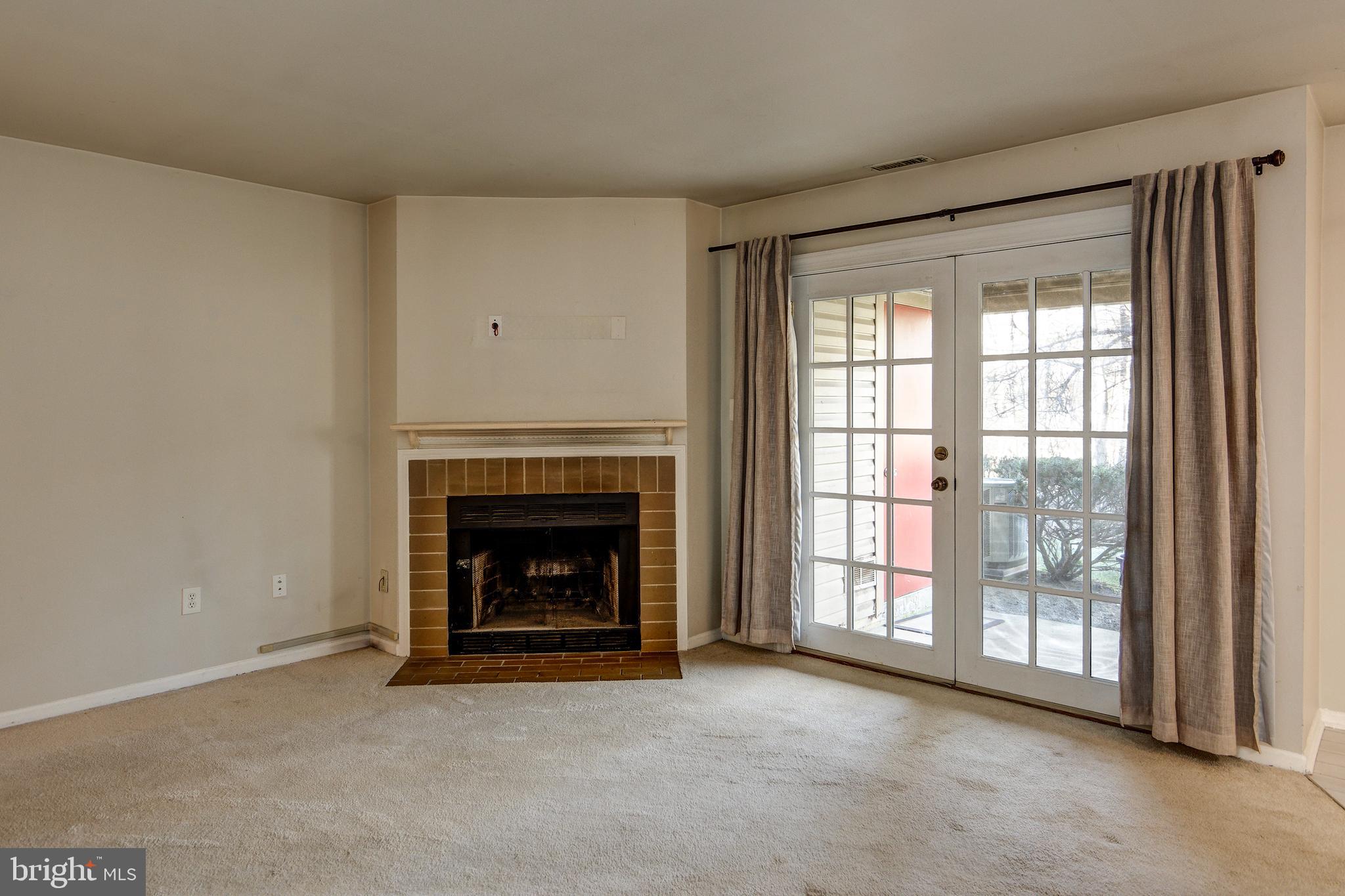 328 Tavistock Cherry Hill, NJ 08034 - Photo 8 of 23 a view of an empty room with a fireplace and a window
