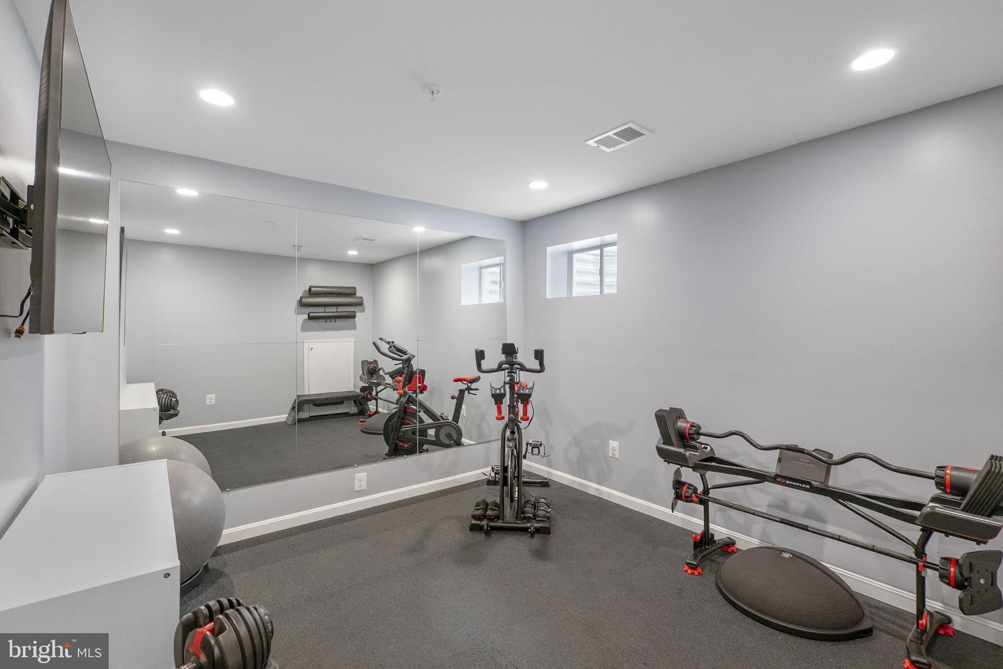 23902 Grapevine Ridge Terrace Clarksburg, MD 20871 - Photo 30 of 44 a view of a room with gym equipment