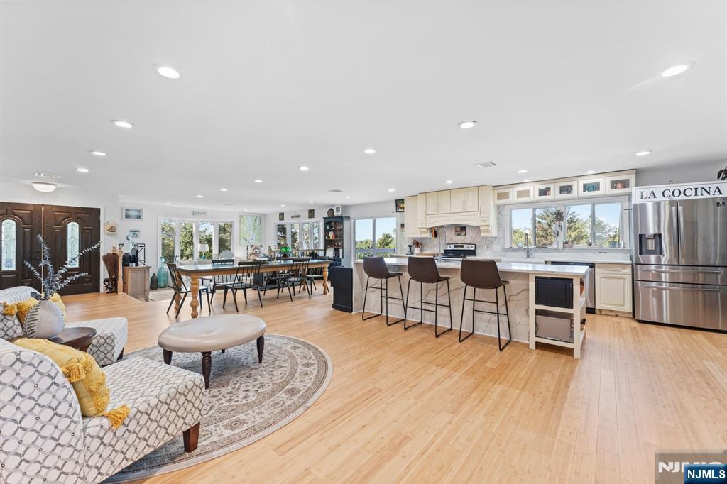 1 Rossi Drive Clinton, NJ 08809 - Photo 12 of 44 a living room with lots of furniture and kitchen view