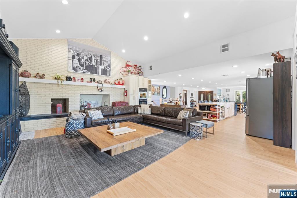 1 Rossi Drive Clinton, NJ 08809 - Photo 16 of 44 a living room with furniture and a wooden floor