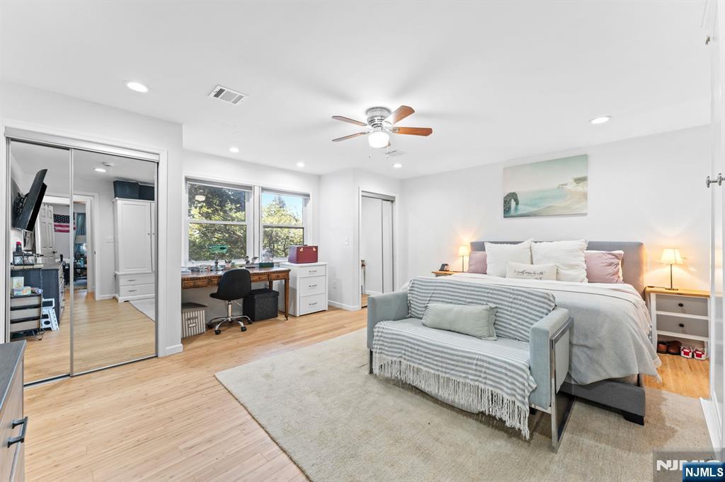 1 Rossi Drive Clinton, NJ 08809 - Photo 20 of 44 a spacious bedroom with a bed couch and a view of living room