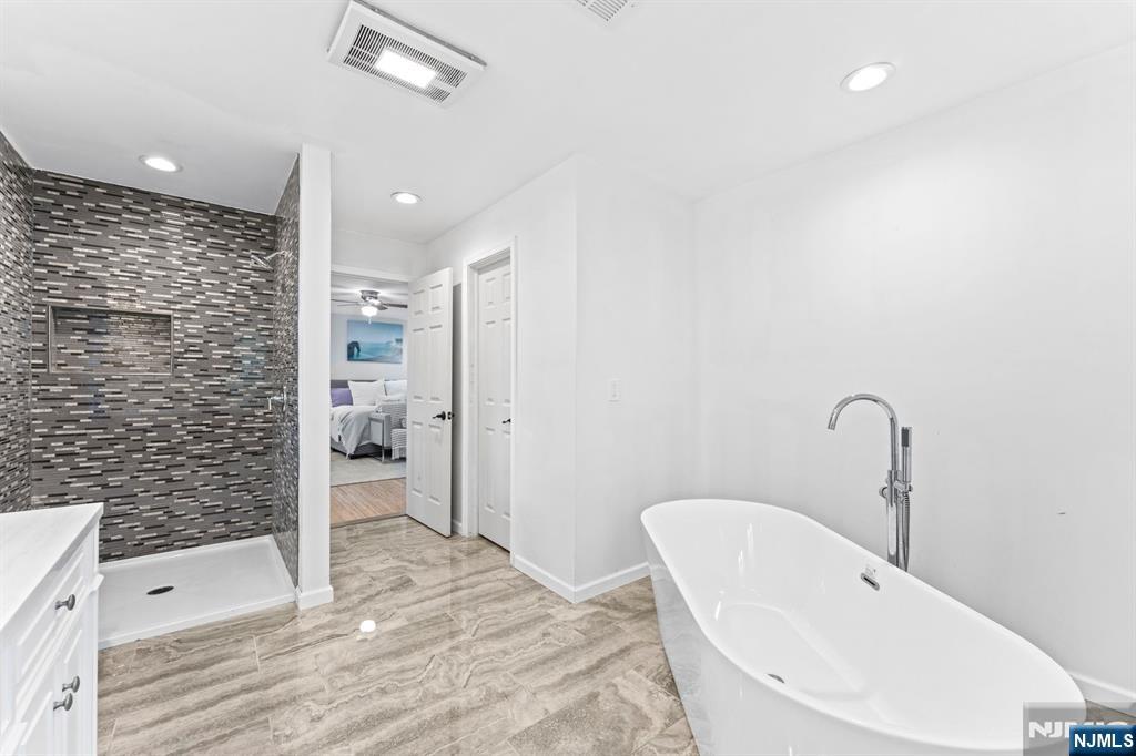 1 Rossi Drive Clinton, NJ 08809 - Photo 23 of 44 a bathroom with a sink a toilet and shower