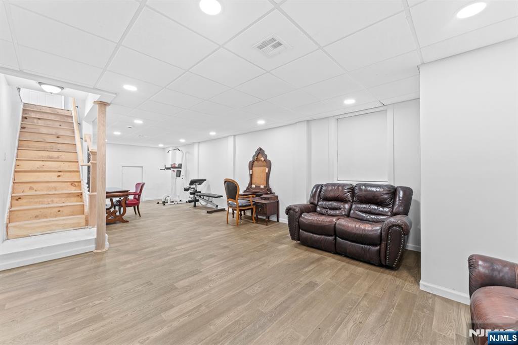 1 Rossi Drive Clinton, NJ 08809 - Photo 26 of 44 a living room with furniture and a wooden floor