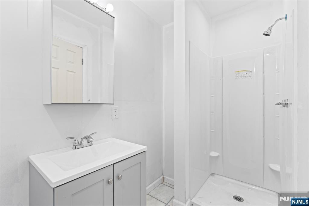 1 Rossi Drive Clinton, NJ 08809 - Photo 31 of 44 a bathroom with a sink a toilet and shower