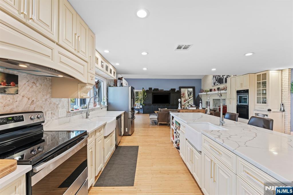 1 Rossi Drive Clinton, NJ 08809 - Photo 9 of 44 a large kitchen with stainless steel appliances
