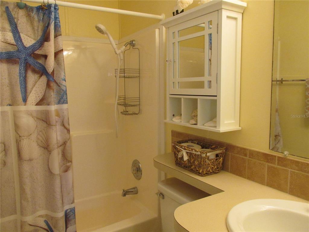 12 Saddle Bag Road Lake Wales, FL 33898 - Photo 12 of 34 a bathroom with a sink a toilet and shower