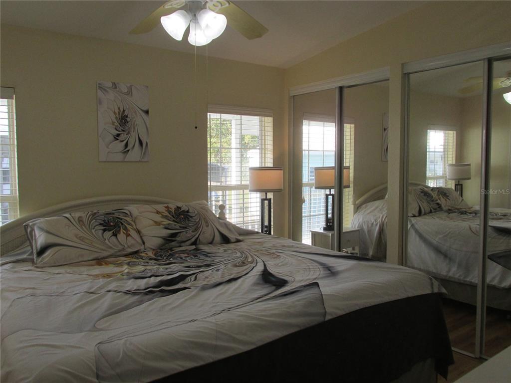 12 Saddle Bag Road Lake Wales, FL 33898 - Photo 13 of 34 a bedroom with a bed and glass window