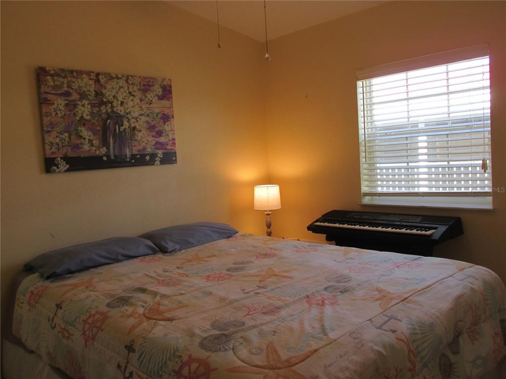 12 Saddle Bag Road Lake Wales, FL 33898 - Photo 19 of 34 a bedroom with a bed and a window