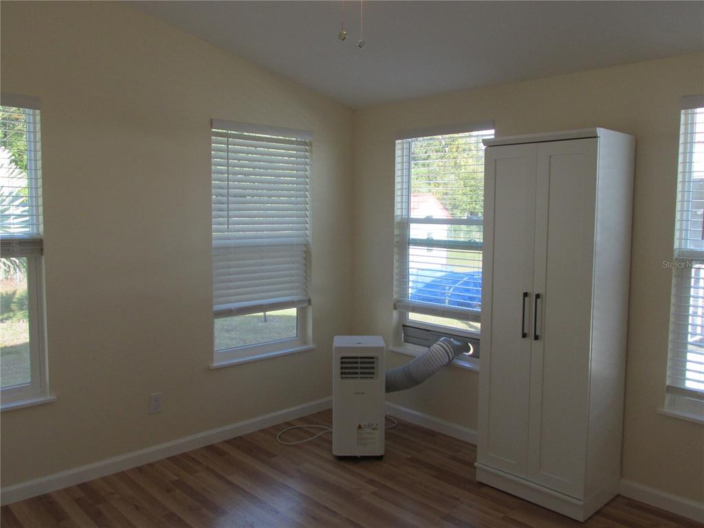 12 Saddle Bag Road Lake Wales, FL 33898 - Photo 20 of 34 a view of empty room with wooden floor and fan