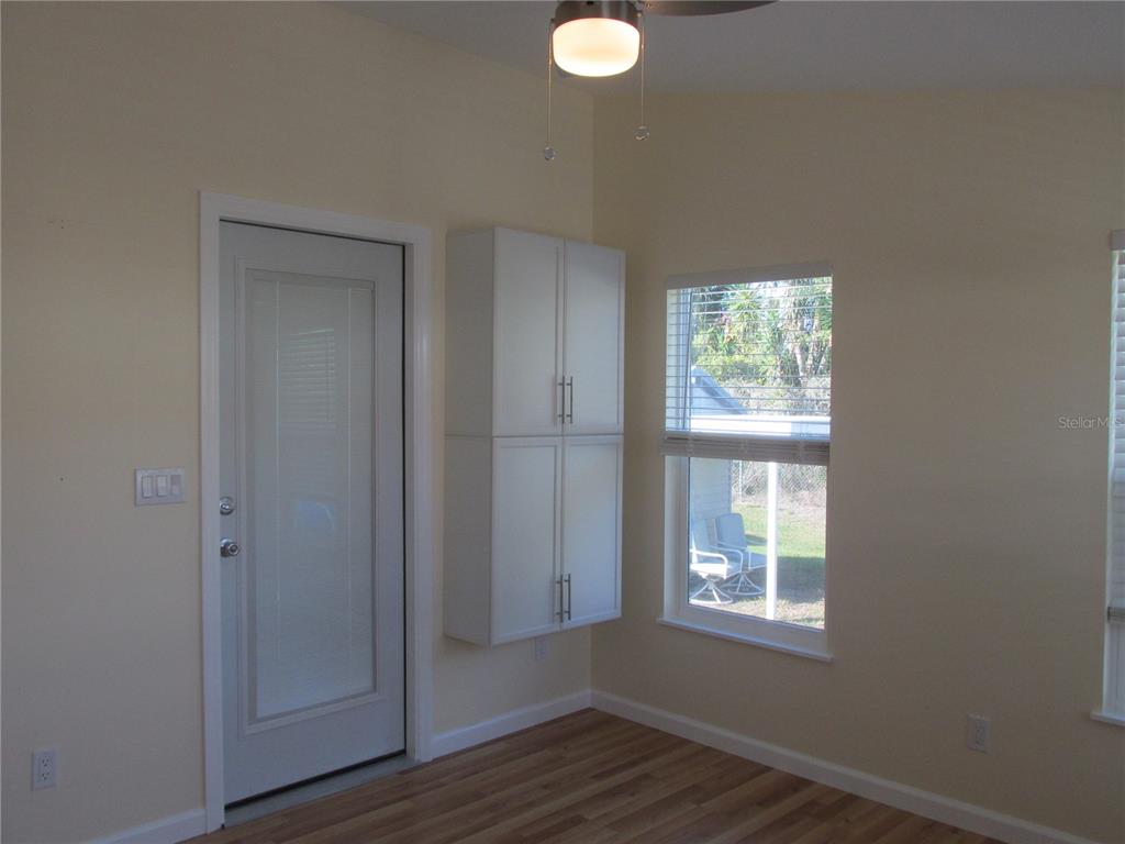 12 Saddle Bag Road Lake Wales, FL 33898 - Photo 21 of 34 a view of an empty room with wooden floor and a window