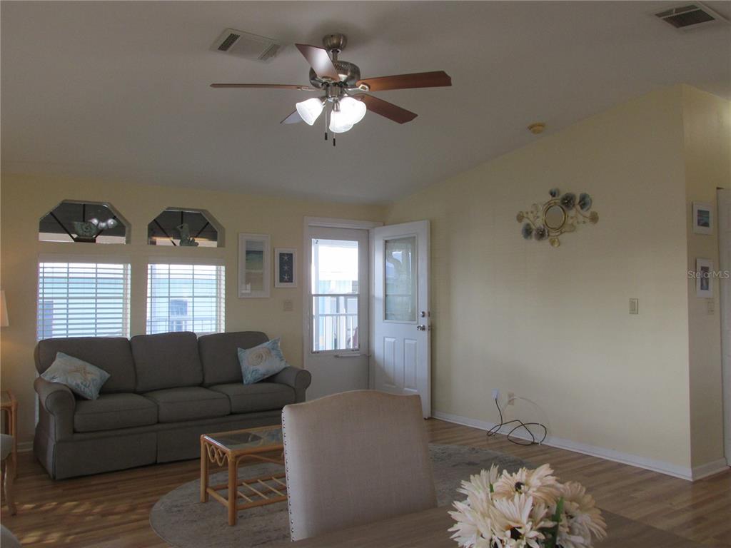 12 Saddle Bag Road Lake Wales, FL 33898 - Photo 4 of 34 a living room with furniture and a chandelier