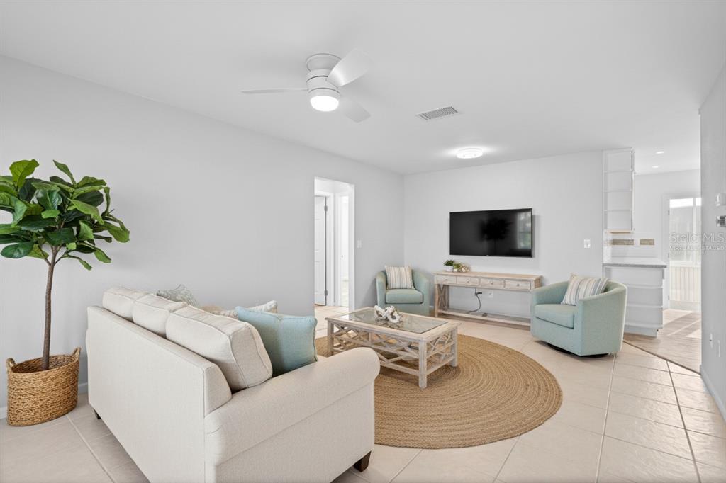 3801 42nd Street West Bradenton, FL 34205 - Photo 5 of 34 a living room with furniture and a flat screen tv