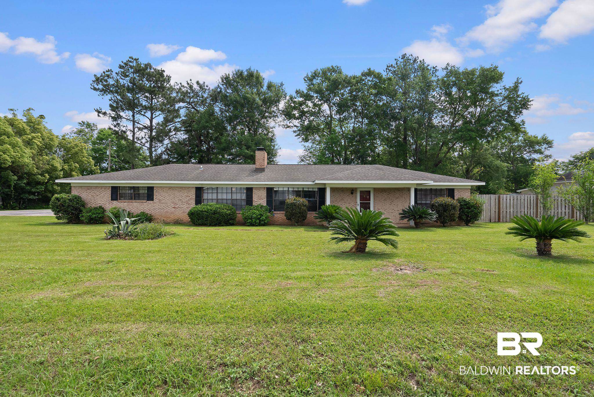 716 North Cedar Street Foley, AL 36535 - Photo 1 of 25 Traditional brick exterior with a low-pitch roofline