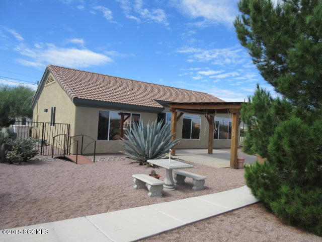 1703 Camino Barrera Rio Rico, AZ 85648 - Photo 6 of 11 a front view of a house with garden