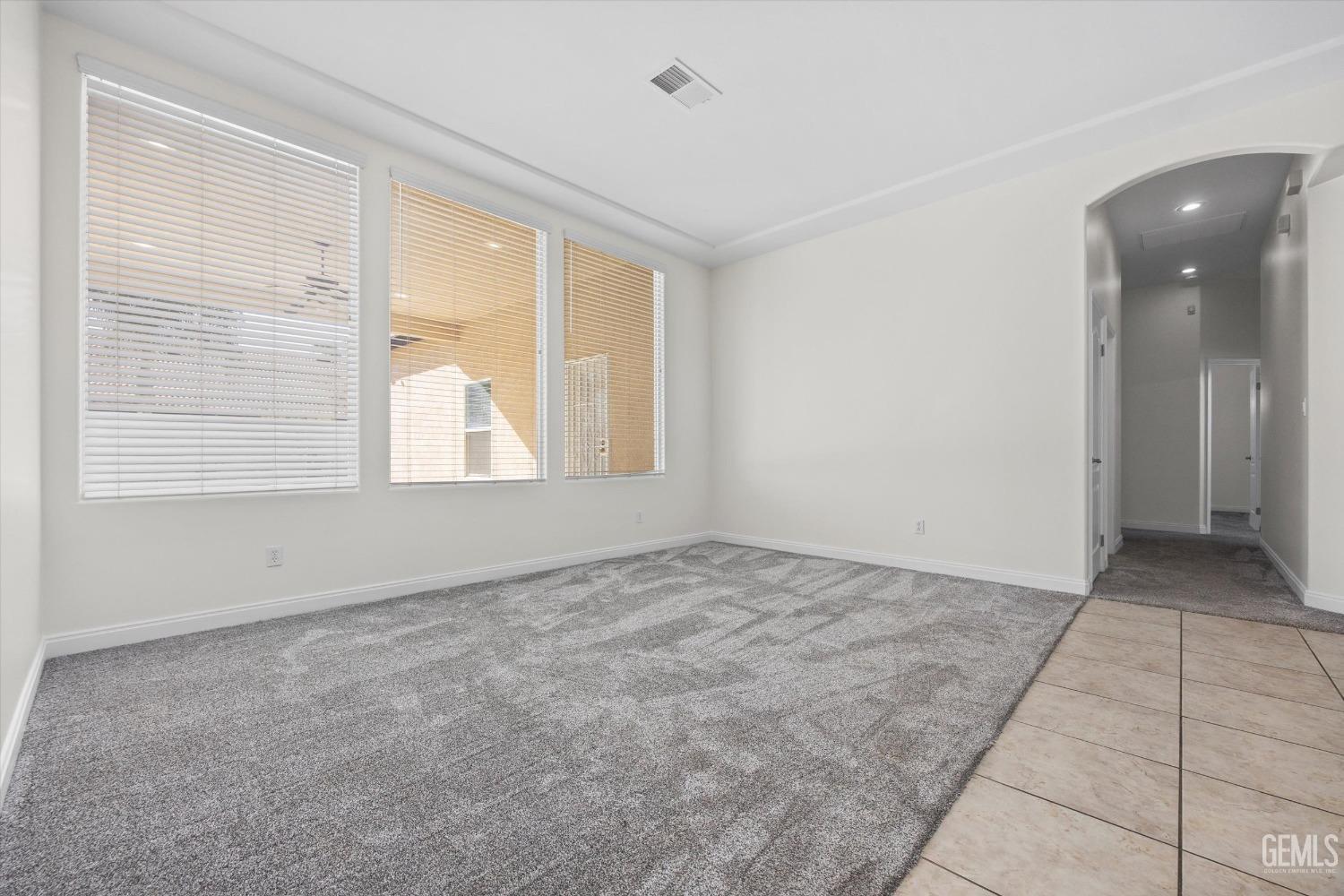 Undisclosed Address Bakersfield, CA 93313 - Photo 14 of 44 a view of an empty room with a window