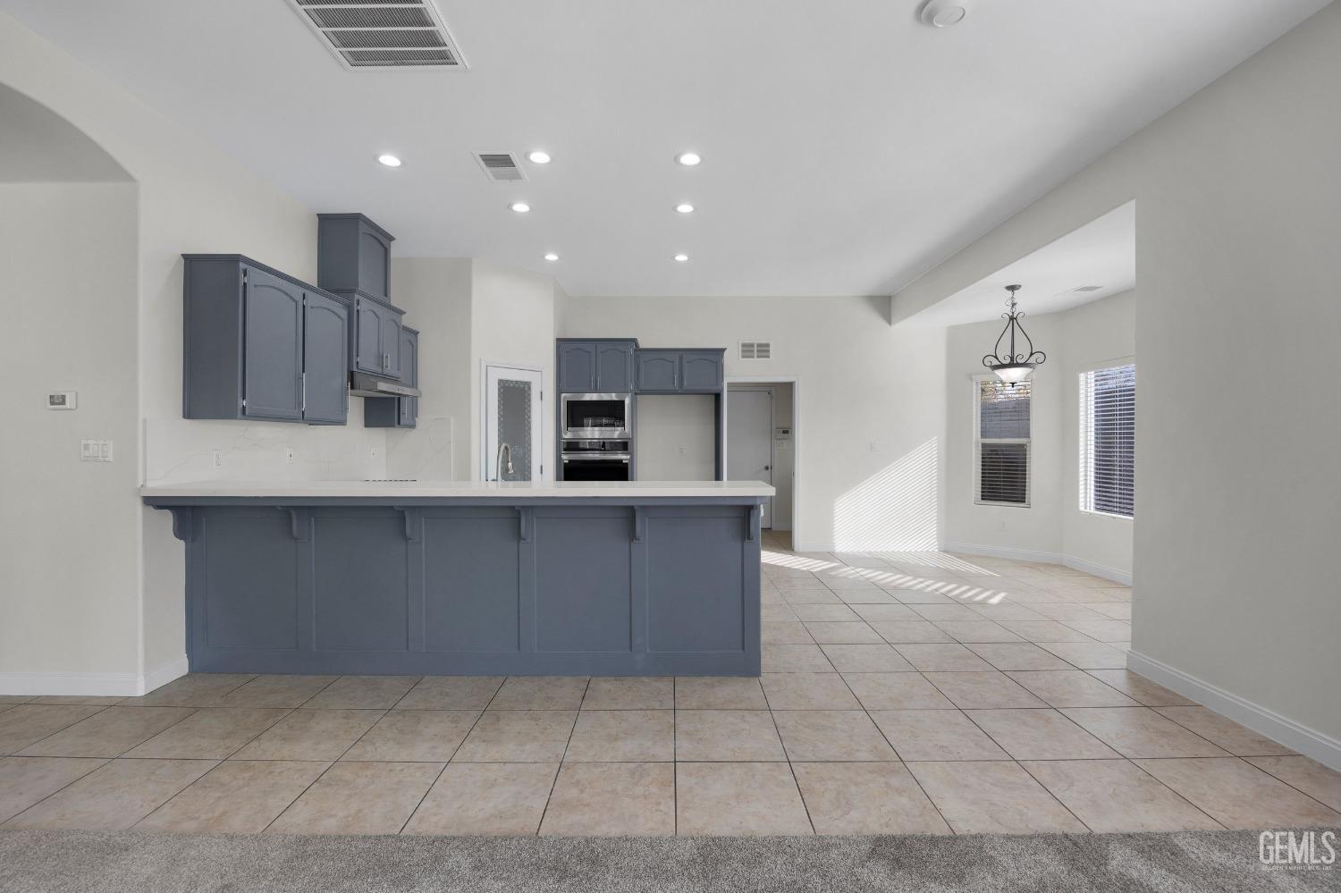 Undisclosed Address Bakersfield, CA 93313 - Photo 17 of 44 a kitchen with stainless steel appliances a refrigerator and a stove top oven