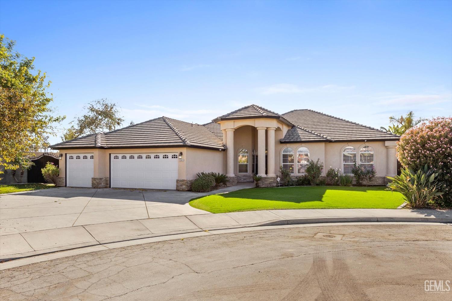 Undisclosed Address Bakersfield, CA 93313 - Photo 2 of 44 a front view of house with yard and green space