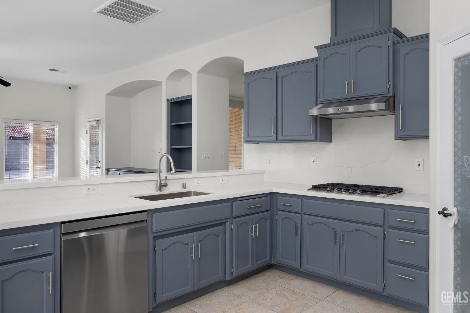 Undisclosed Address Bakersfield, CA 93313 - Photo 21 of 44 a kitchen with sink and cabinets