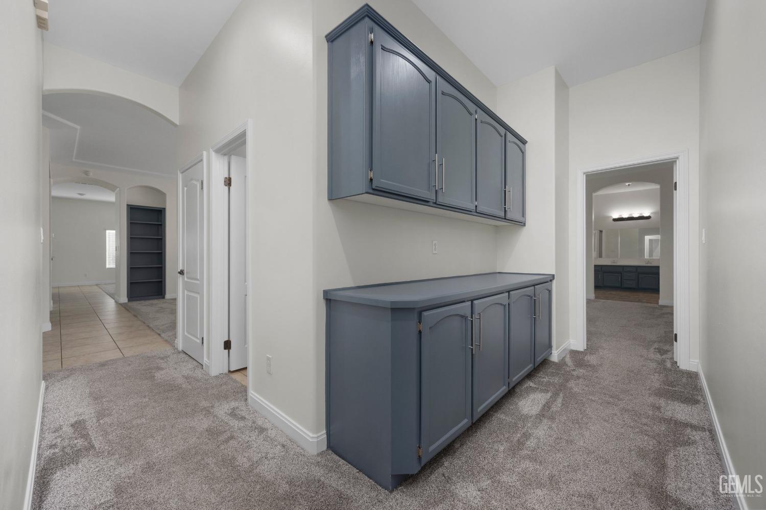 Undisclosed Address Bakersfield, CA 93313 - Photo 25 of 44 a kitchen with white cabinets