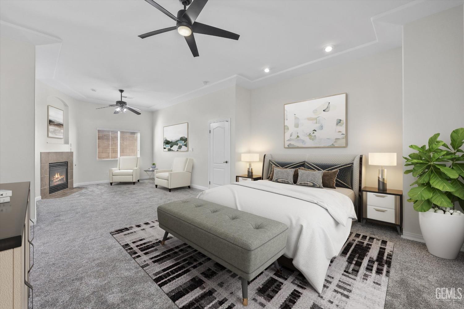 Undisclosed Address Bakersfield, CA 93313 - Photo 28 of 44 a spacious bedroom with a bed a couch and potted plant