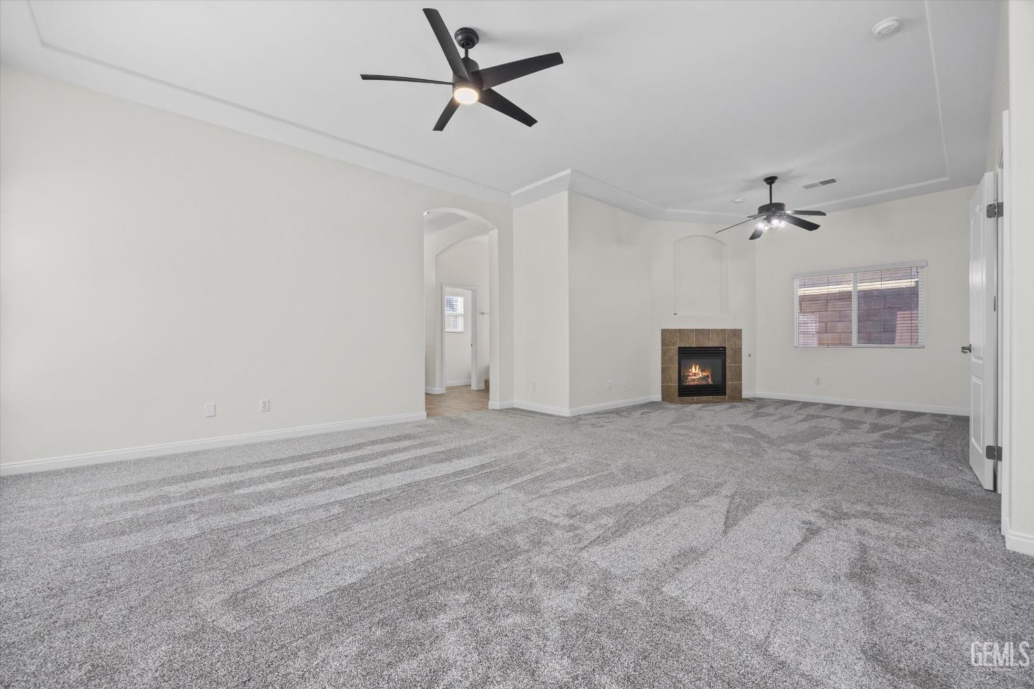 Undisclosed Address Bakersfield, CA 93313 - Photo 29 of 44 a view of a livingroom with a ceiling fan and wooden floor