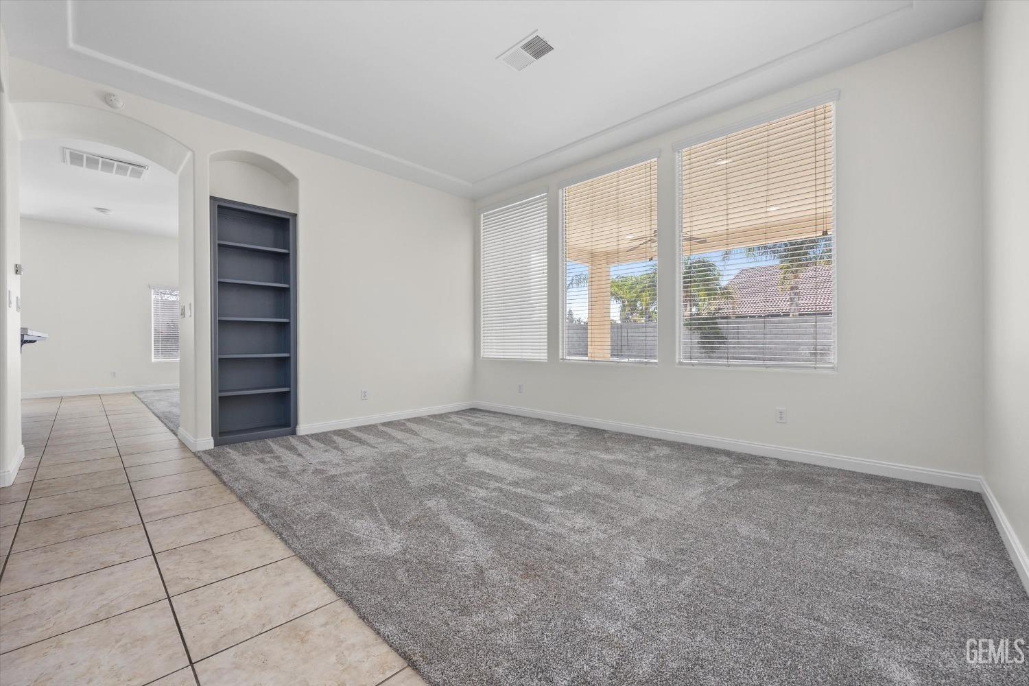 Undisclosed Address Bakersfield, CA 93313 - Photo 4 of 44 wooden floor in an empty room with a window