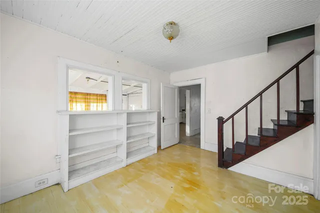 a bathroom with a sink mirror and toilet