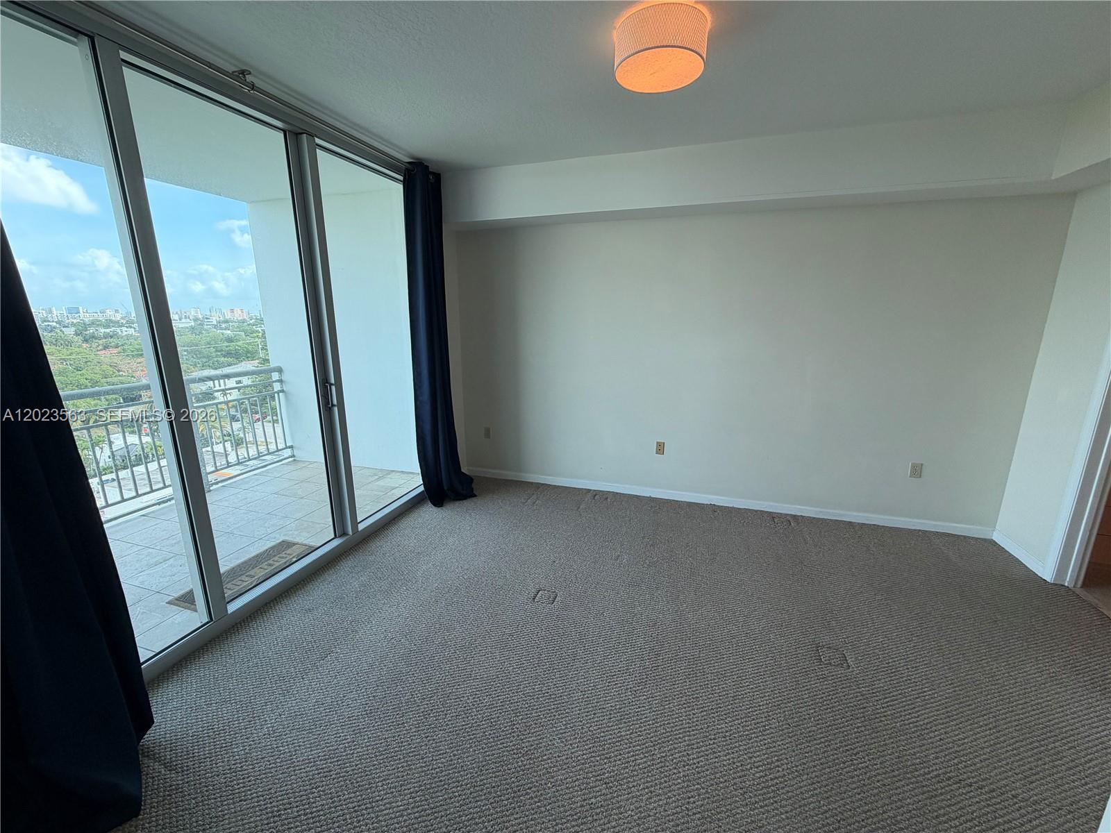 2021 Southwest 3rd Avenue, Unit 902 Miami, FL 33129 - Photo 4 of 14 a view of an empty room with a window
