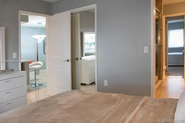 a bedroom with a bed and a table